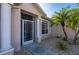 Front entrance with teal door, white columns, and a screen door at 24060 Buckingham Way, Punta Gorda, FL 33980