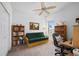 Home office with a futon and built-in bookcases at 24060 Buckingham Way, Punta Gorda, FL 33980