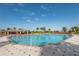 Large community pool with ample lounge chairs at 24060 Buckingham Way, Punta Gorda, FL 33980