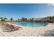 Resort-style pool with plenty of lounge chairs at 24060 Buckingham Way, Punta Gorda, FL 33980