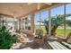 Relaxing sunroom overlooking a lush green golf course at 24060 Buckingham Way, Punta Gorda, FL 33980