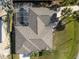 Top-down view of a single-Gathering home, showcasing the roofline, pool, and backyard at 2418 Frantz St, North Port, FL 34286