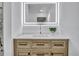 Vanity with modern sink, lighted mirror, and sleek design at 2418 Frantz St, North Port, FL 34286