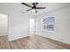 Simple bedroom with tile floor, large window, and access to a closet at 2418 Frantz St, North Port, FL 34286