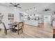 Bright dining room with wood table and chairs, adjacent to kitchen at 2418 Frantz St, North Port, FL 34286