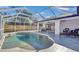 Inviting screened pool and patio area, perfect for relaxation at 2418 Frantz St, North Port, FL 34286