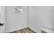 Small room with wood-look floors and white walls at 2418 Frantz St, North Port, FL 34286