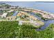 Aerial view of waterfront community and surrounding nature at 25188 Marion Ave # 1011, Punta Gorda, FL 33950