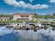 Waterfront marina with boats and community clubhouse at 25188 Marion Ave # 1011, Punta Gorda, FL 33950