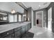 Elegant bathroom with dark wood cabinets, marble countertops, and a large mirror at 2521 Rio Grande Dr, Punta Gorda, FL 33950