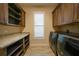 Bright laundry room with cabinets and a window at 2521 Rio Grande Dr, Punta Gorda, FL 33950