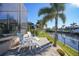 Relaxing patio with seating and waterfront views at 2521 Rio Grande Dr, Punta Gorda, FL 33950