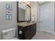 Bathroom features a dark wood vanity and a large mirror at 2730 Rio Ct, Punta Gorda, FL 33950