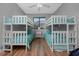 Bedroom with two bunk beds and wood flooring at 2730 Rio Ct, Punta Gorda, FL 33950