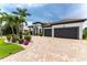 Beautiful home with two-car garage and nicely landscaped front yard at 2730 Rio Ct, Punta Gorda, FL 33950