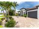 Two-story home with dark gray garage door at 2730 Rio Ct, Punta Gorda, FL 33950