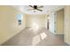 Bright bedroom with ceiling fan and window at 282 Seminole Nw Blvd, Port Charlotte, FL 33952