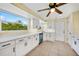 Bright kitchen with white cabinets, quartz countertops, and stainless steel appliances at 282 Seminole Nw Blvd, Port Charlotte, FL 33952