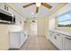 Bright kitchen with white cabinets and quartz countertops at 282 Seminole Nw Blvd, Port Charlotte, FL 33952