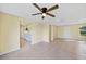 Living room with ceiling fan and kitchen view at 282 Seminole Nw Blvd, Port Charlotte, FL 33952