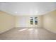 Bright and airy living room with tile floors at 282 Seminole Nw Blvd, Port Charlotte, FL 33952