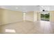 Spacious living area with sliding glass doors at 282 Seminole Nw Blvd, Port Charlotte, FL 33952