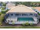 Aerial view of home with pool and screened enclosure at 2856 Deborah Dr, Punta Gorda, FL 33950