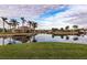 Waterfront property with lush landscaping and palm trees at 2856 Deborah Dr, Punta Gorda, FL 33950