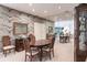 Elegant dining room features a wood table and mirrored accent wall at 2856 Deborah Dr, Punta Gorda, FL 33950