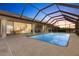 Scenic pool and patio with screened enclosure at sunset at 2856 Deborah Dr, Punta Gorda, FL 33950