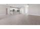 Open concept kitchen with white cabinets and island at 3334 Levee St, North Port, FL 34288