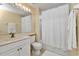 Clean bathroom with a shower/tub combo, vanity, and white fixtures at 3500 Mondovi Ct # 212, Punta Gorda, FL 33950