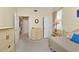 Guest bedroom with day bed, dresser, and access to the hallway at 3500 Mondovi Ct # 212, Punta Gorda, FL 33950