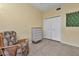 Condo bedroom with wicker chair and built-in dresser at 3500 Mondovi Ct # 212, Punta Gorda, FL 33950