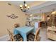 Dining area with kitchen access and wicker chairs at 3500 Mondovi Ct # 212, Punta Gorda, FL 33950