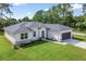 Single-story house with gray roof and a two-car garage at 4024 Feather Ter, North Port, FL 34286