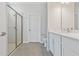 Modern bathroom with white vanity, quartz countertop, and glass shower at 4024 Feather Ter, North Port, FL 34286