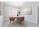 Elegant dining room with round table and modern chairs at 4024 Feather Ter, North Port, FL 34286