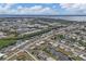 Aerial view of residential neighborhood near waterfront with canals at 4118 Gardner Dr, Port Charlotte, FL 33952