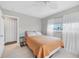 Bedroom with orange bedding and access to a bathroom at 4118 Gardner Dr, Port Charlotte, FL 33952