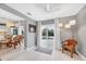 Living area with wicker chair and sliding glass doors to pool at 4118 Gardner Dr, Port Charlotte, FL 33952