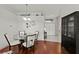 Dining area with hardwood floors and view of entryway at 4465 Kaskin Ave, North Port, FL 34286