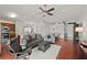 Living area with hardwood floors and a gray sofa and armchairs at 4465 Kaskin Ave, North Port, FL 34286