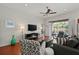 Living room with hardwood floors and view of the pool at 4465 Kaskin Ave, North Port, FL 34286