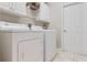 Laundry room with washer, dryer, and storage cabinets at 4557 Sabrina Ter, North Port, FL 34286