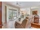 Living room with tiled floors, and view of kitchen at 4557 Sabrina Ter, North Port, FL 34286