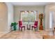 Living area with tiled floors, two red chairs and a window at 4557 Sabrina Ter, North Port, FL 34286