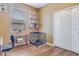 Home office with a desk, dog cage, and built-in closet at 4557 Sabrina Ter, North Port, FL 34286