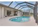 Inviting kidney-shaped pool with screened enclosure at 4557 Sabrina Ter, North Port, FL 34286