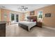 Main bedroom with king-size bed and access to the backyard at 5208 Griggs Ave, North Port, FL 34291